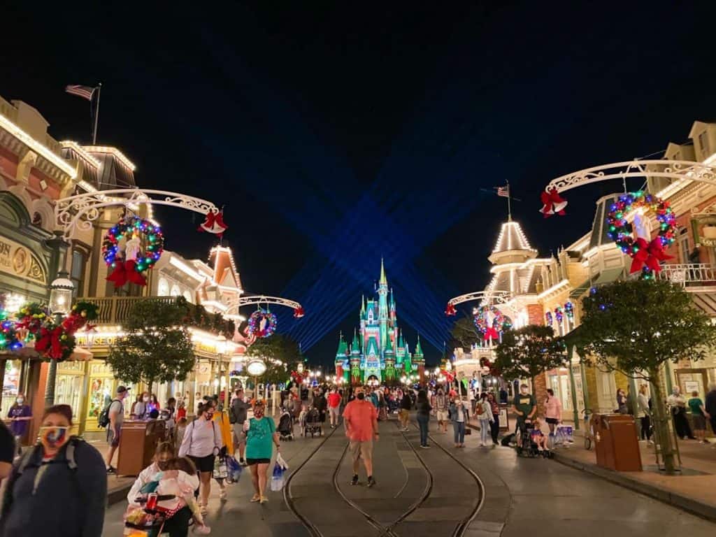 A look down Main Street in the Magic Kingdom, all decorated with Christmas lights for truly festive Florida Christmas vacations.
