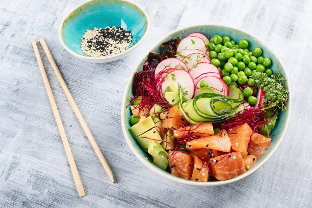 Beautiful salmon poke bowl is colorful and fresh