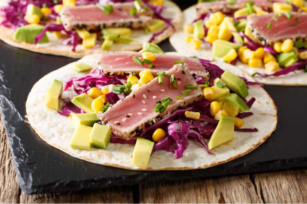 Seared ahi tuna tacos open faced with avocado