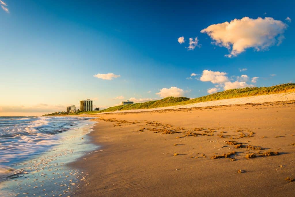 The cinnamon sands of Coral Cove Park, one of the best things to do in Jupiter, are inviting and feel soft against your feet.