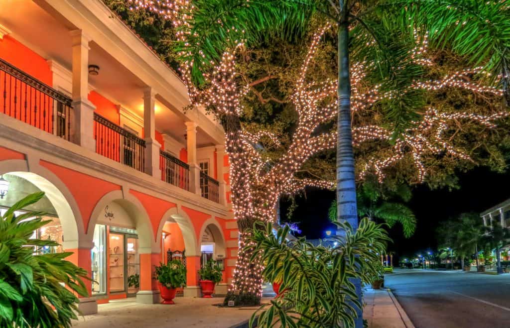 A historic building with a light-decked tree in one of the florida christmas towns