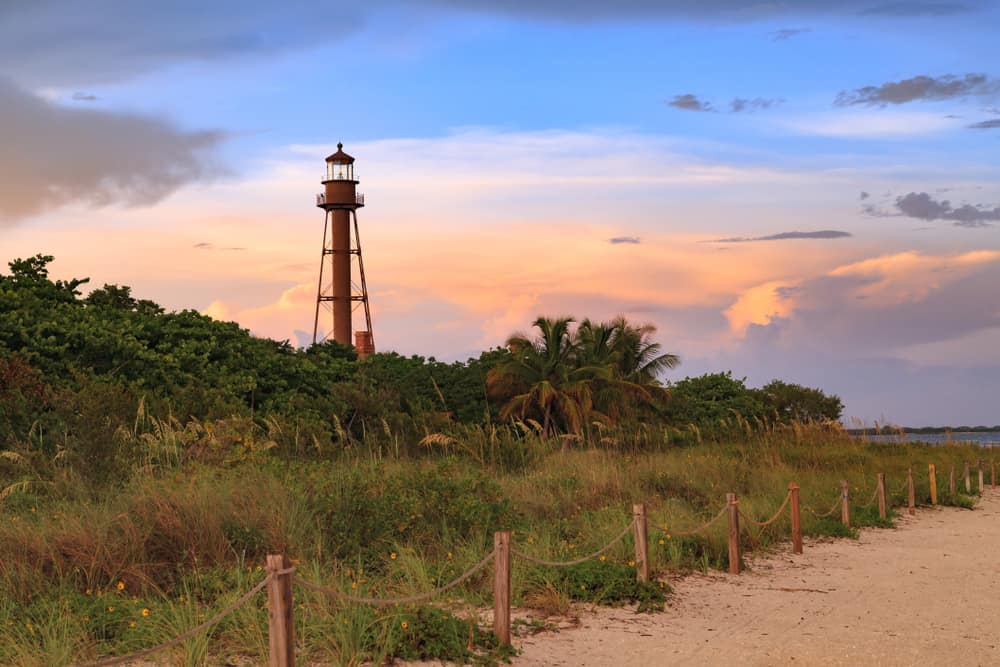 The Sanibel Lighthouse sets a strong contrast to a sunset.