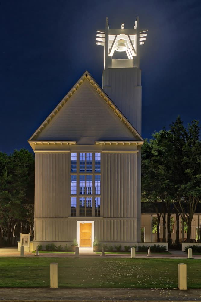 The Chapel at Seaside with its bell-tower illuminated at night, one of the best things to do in Seaside, Florida.