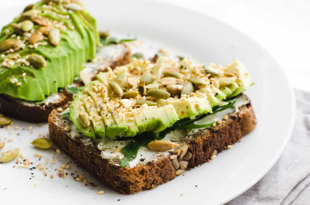 avocado toast on a white plate at a breakfast restaurant in fort lauderdale