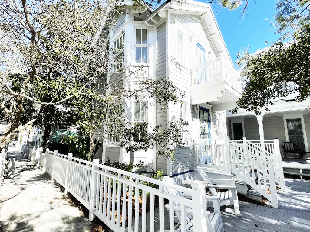Beautiful white beach house with a white fence one of the Seaside Florida rentals