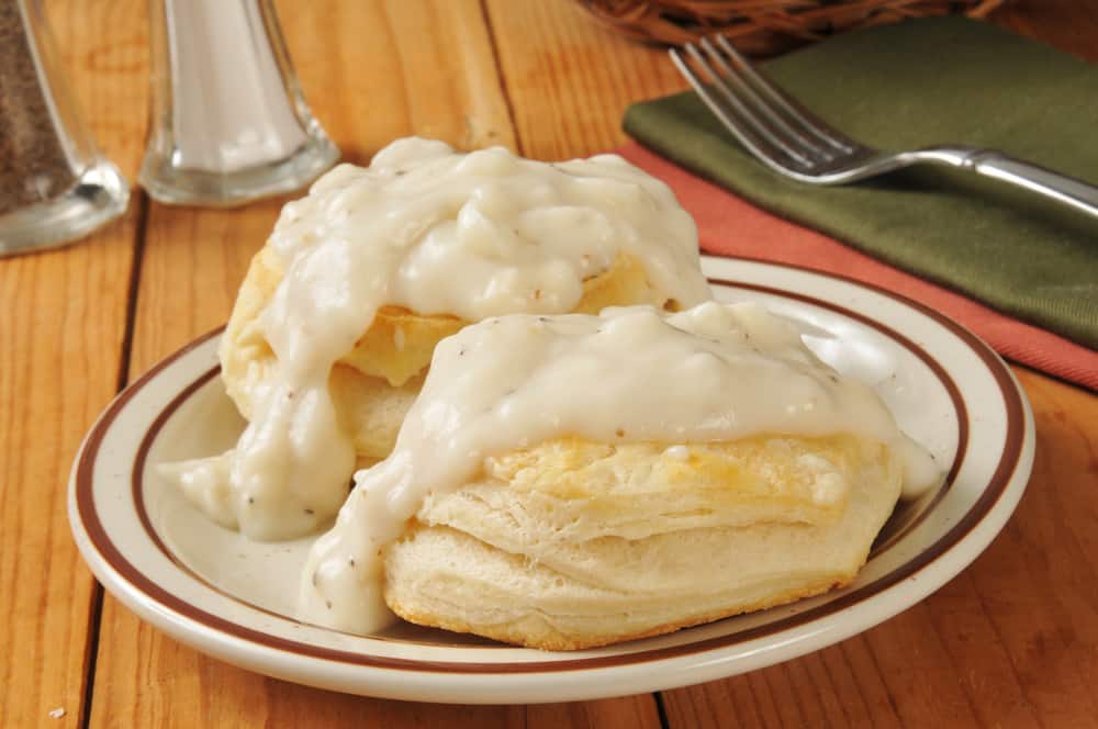 biscuits and grace on a plate for the best breakfast in Anna Maria Island