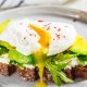 Avocado toast with poached egg and cheese, similar to what you can get for breakfast in Naples, FL.