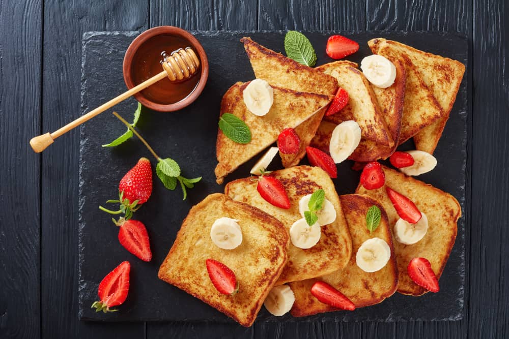 French Toast with strawberries and bananas at one of the best restaurants in Miami for breakfast, Green Street Cafe. 