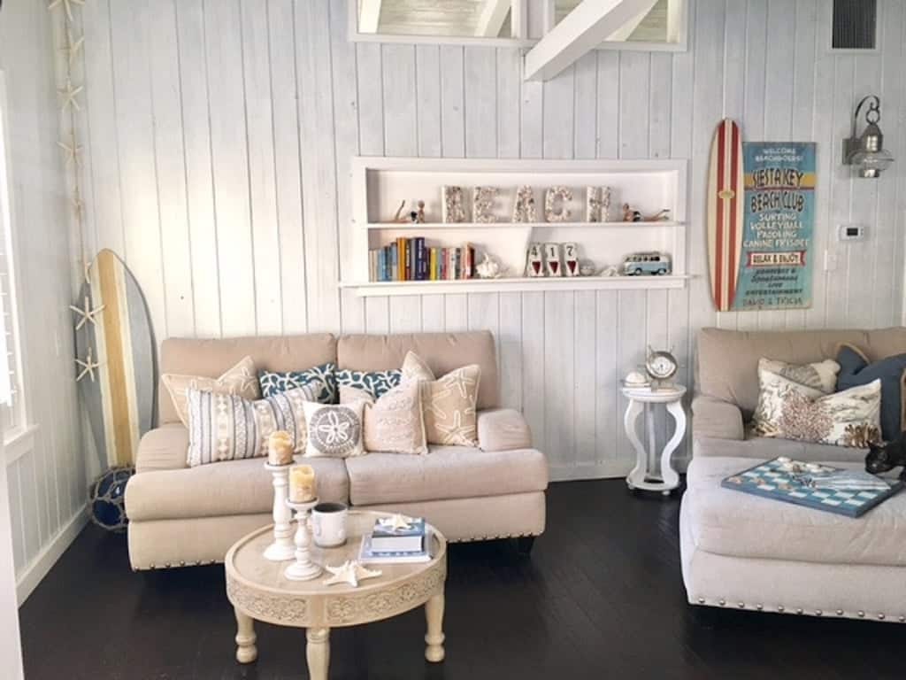 This beautiful beach front property is one of the cottages in Florida with wooden floors ad white washed walls decorated in nautical theme