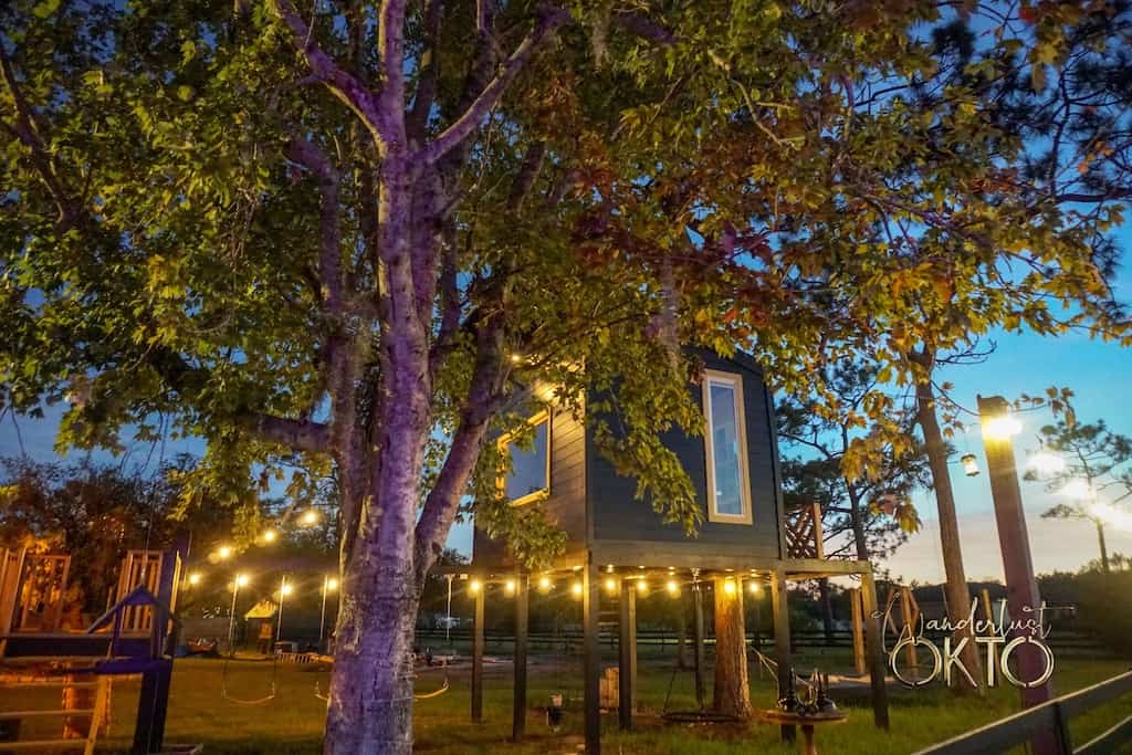 With twinkle lights and surrounded by a play set the The Hive at Wanderlust Okto is a magical treehouse