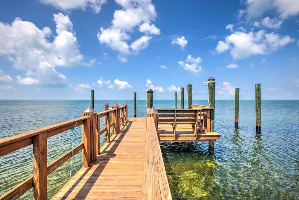 The blue sky and Atlantic ocean surrounding the private dock that comes with this rental property. The dock can fit up to a 30 foot boat! This is one of the best airbnbs in Florida. 