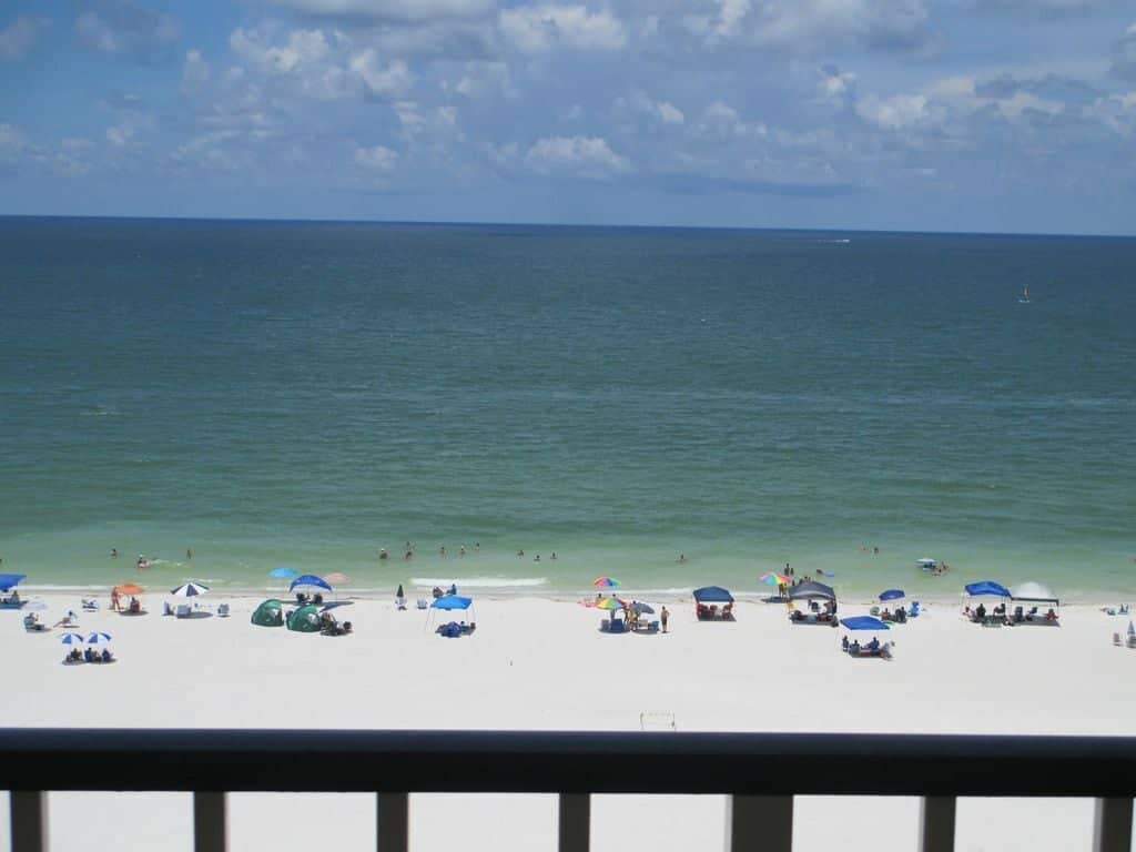 View from the 9th floor of the Apollo Condos of the white sandy beach and teal Gulf of Mexico. 