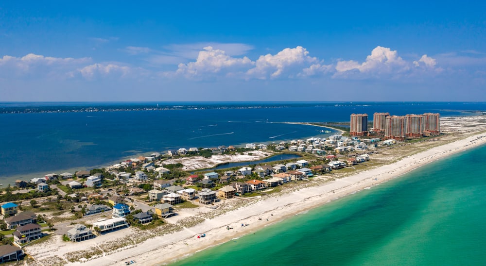 Pensacola is one of the best places to visit in Florida because it is famous for its white sands and clear waters, like shown in this photo.