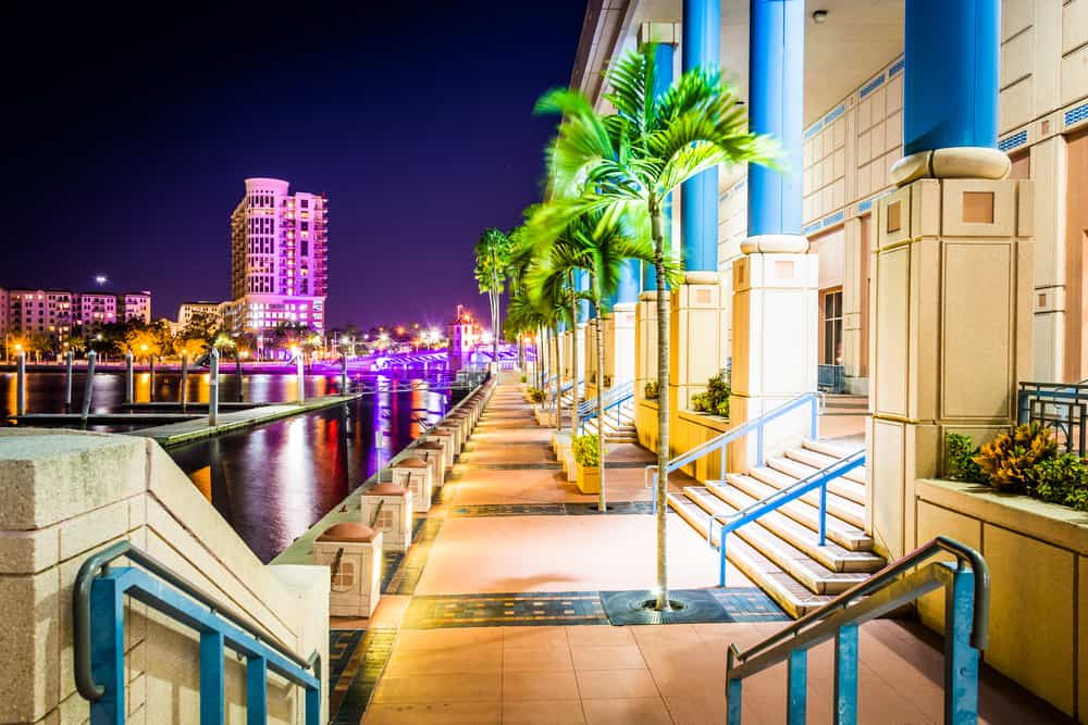 Tampa is one of the best places to visit in Florida, and this photo highlights the night life and lights on its riverwalk.