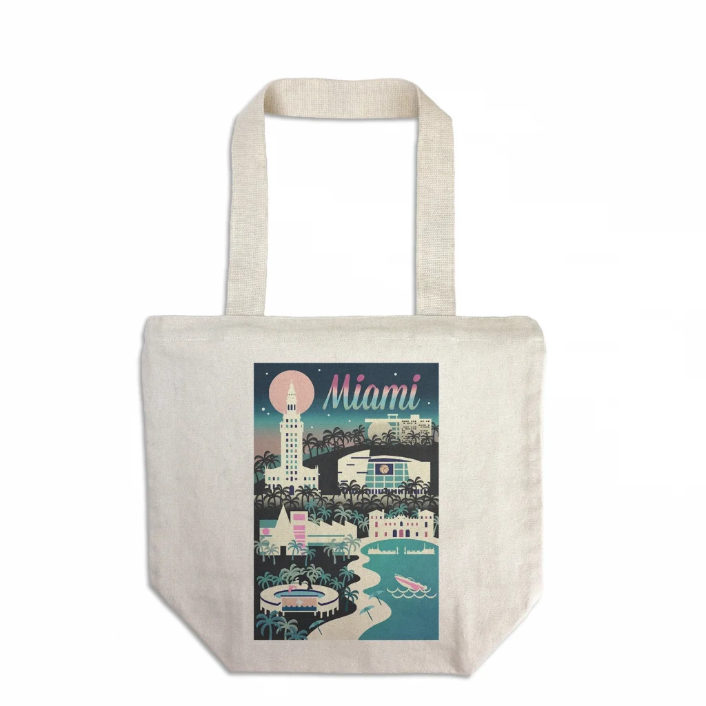 A picture of a cotton tote back with a vintage cartoon depiction o the Miami Skyline in pastel color palette, on a white background. A great Miami Gift!