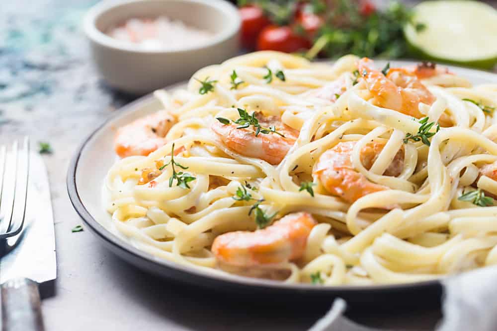 A heaping plate of shrimp Alfredo.
