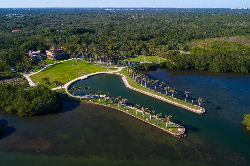 aerial view of the deering estate, showing the backyard which turns into two prongs of a fork shape that you can dock a boat into for weddings