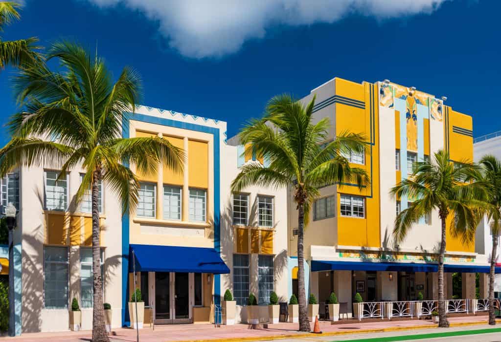 Two colorful yellow and blue art-deco style buildings