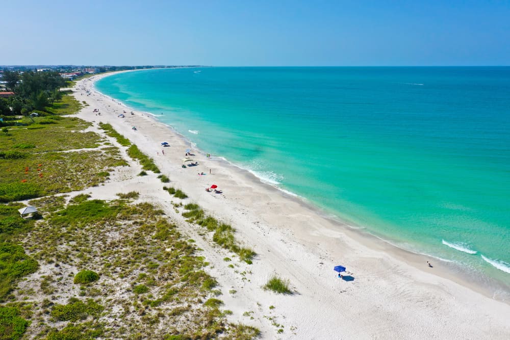 An aerial view of Anna Maria Island with white sand and the clearest water in Florida
