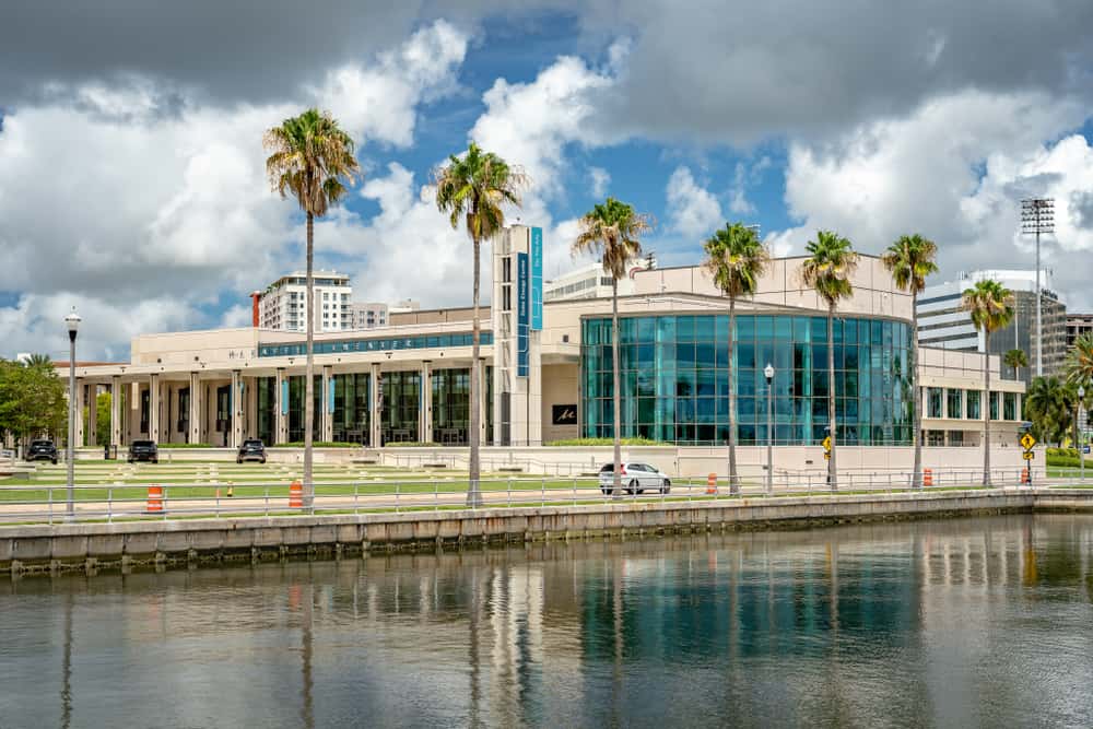 The blue-windowed exterior of the Duke Energy Center for the Arts, where attending Mahaffey Theater is one of the best things to do in St. Petersburg for couples.