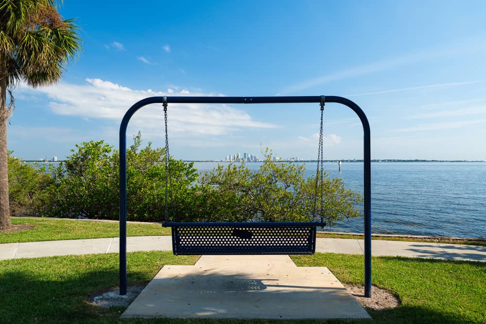 A swinging bench facing a bay with views of Tampa Florida. 