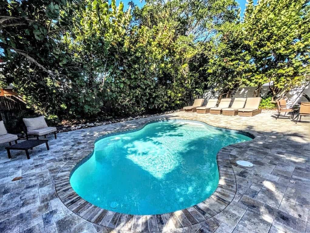 View of the beautiful pool in the backyard of The Bay Esplanade House. 