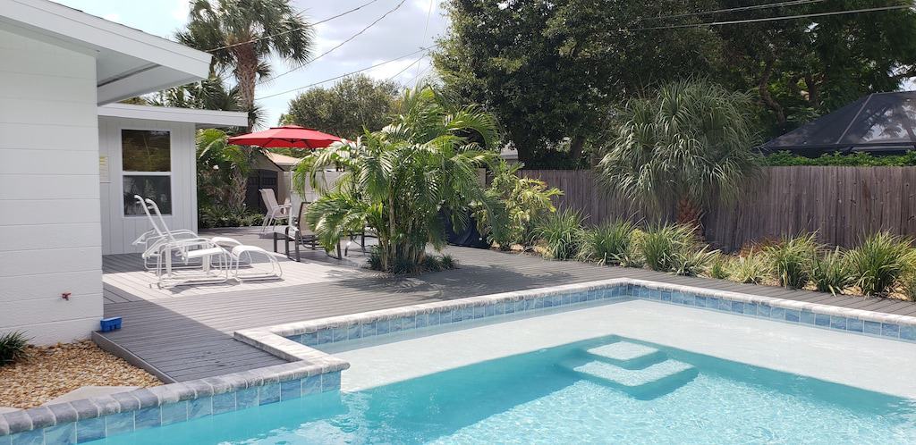 The deck and private pool of the Private Backyard Heated Pool property. 