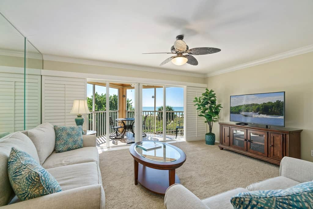 Photo of the beautiful living room with an ocean view at the Beachfront Condo on Longboat Key. 