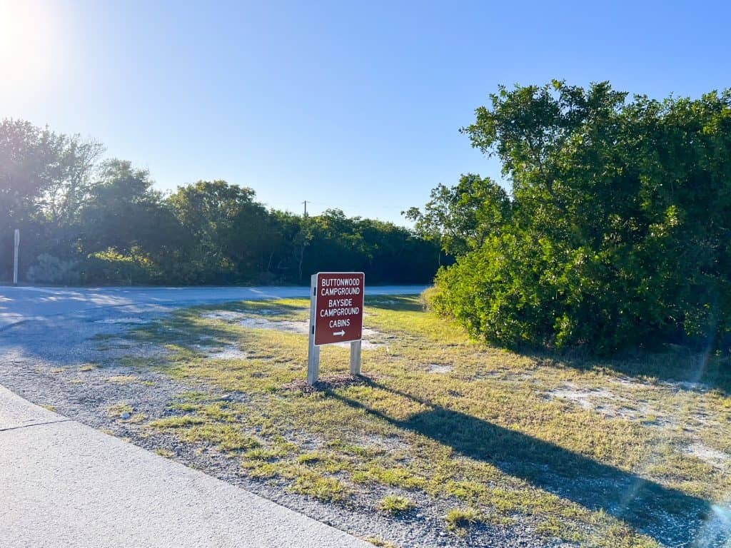 The sign of the Buttonwood and Bayside Campgrounds points visitors in the right direction of where to stay when camping at Bahia Honda State Park.