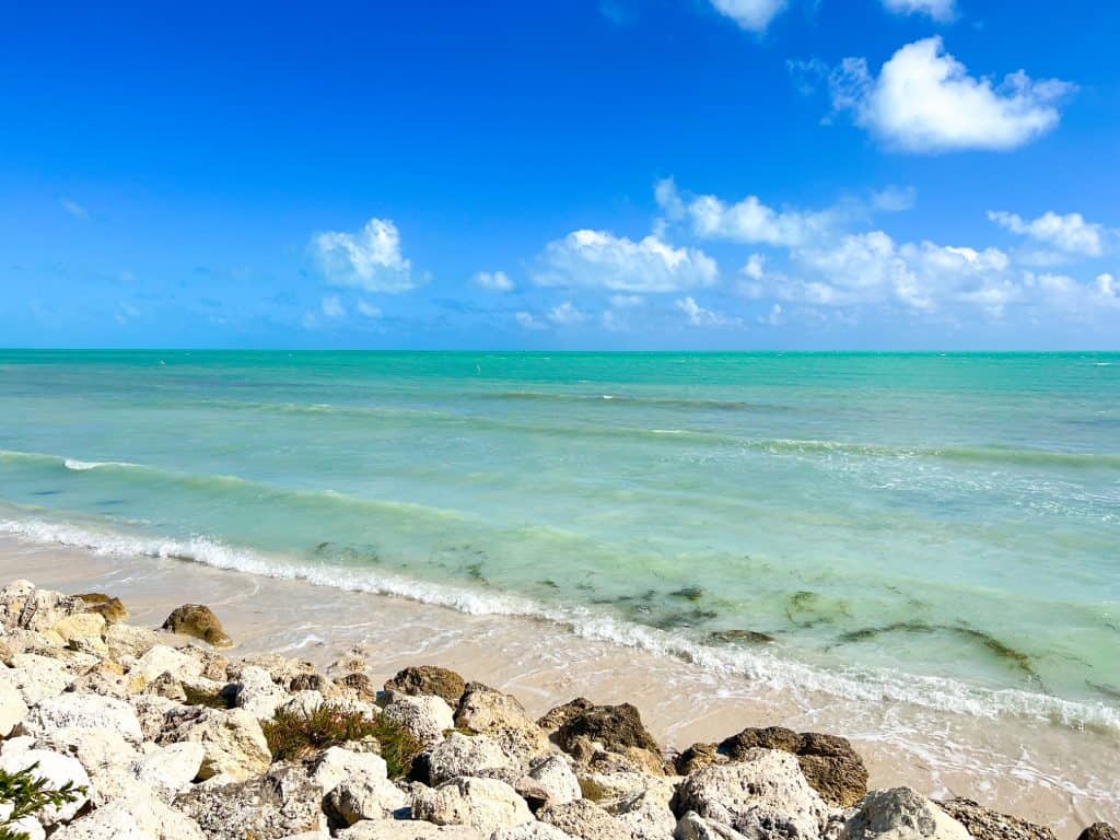 The rocky shoreline and waves at Bahia Honda State Park beaches.