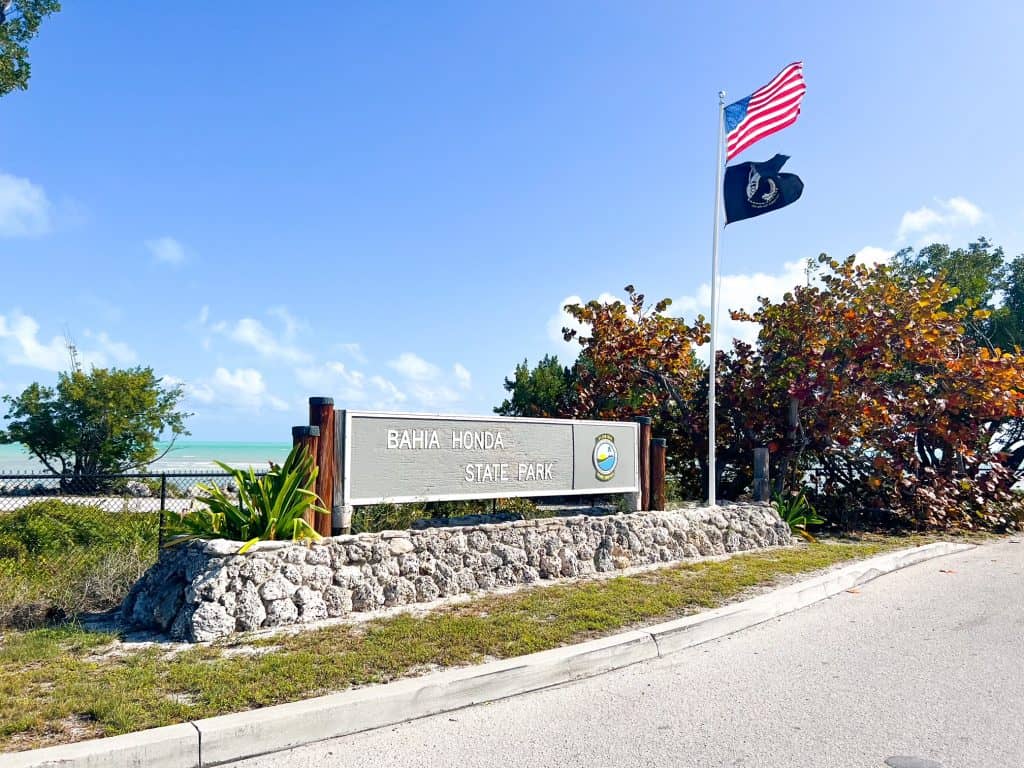 The Bahia Honda State Park sign labels the beaches and campsites by the side of the road.