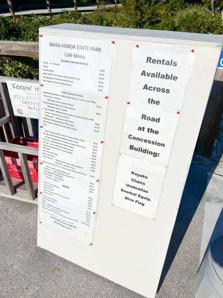 A sign that breaks down the rental information and lists the best things to do at Bahia Honda State Park.