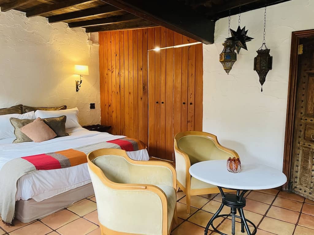 view of the bed, cool lanterns and wood features of the Casita. 