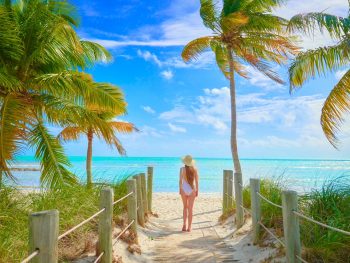 woman standing on smathers beach during a weekend in key west
