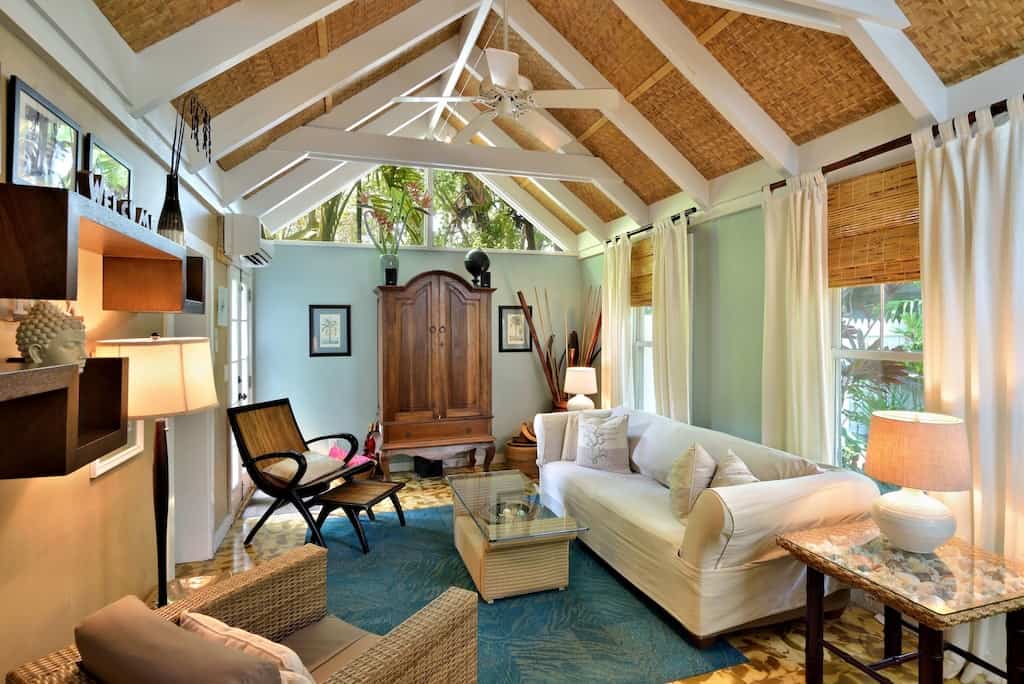 The calming interior of the Tranquil Cottage, featuring high bamboo ceilings and lots of windows. 