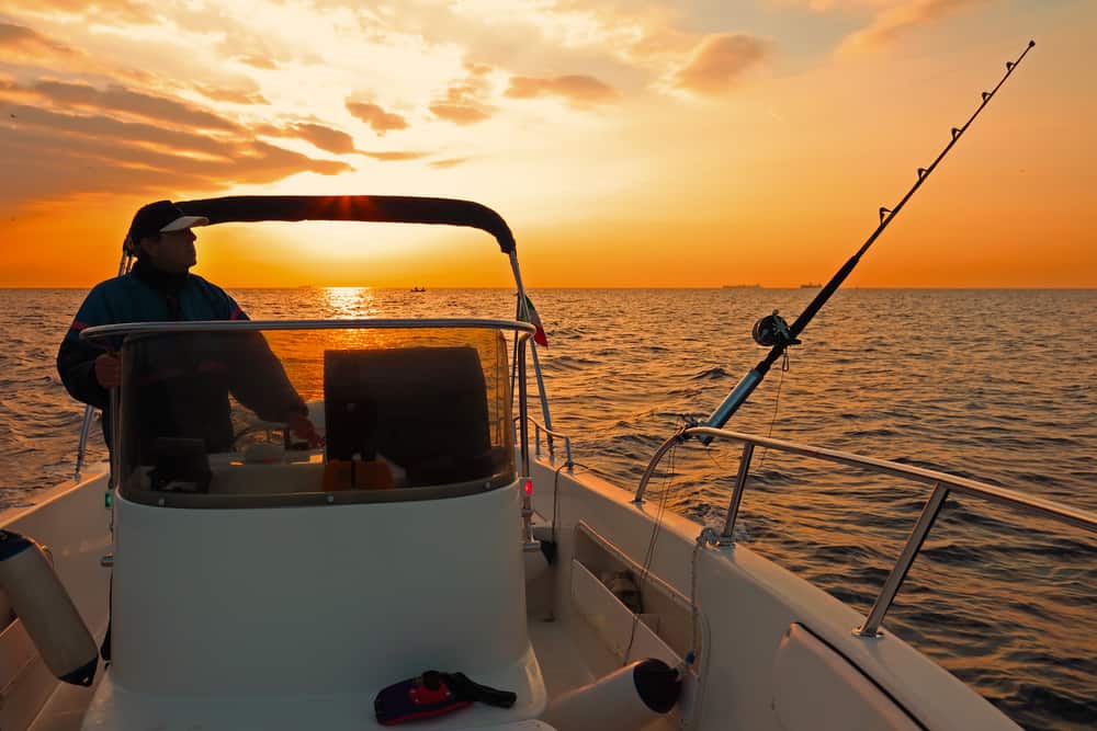 a fishing charter at sunset on a boat in the ocean