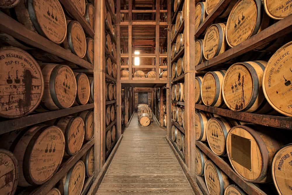 A room full of barrels full of rum and whiskey. 