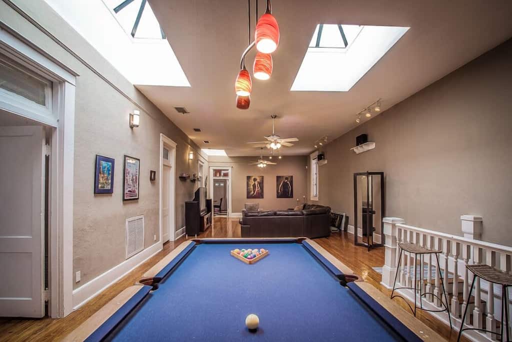 View of the pool table in the great room of this spacious historic loft in Ybor. 