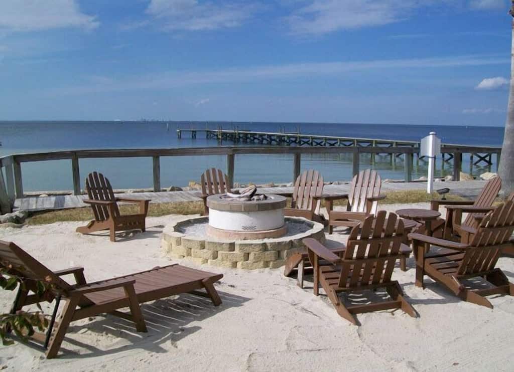 View of the firepit and fishing dock of the Little Harbor resort 