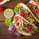 Soft tacos, like the ones from Tia's Tacos (one of the best Restaurants in Daytona), sit on a towel, waiting to be served!