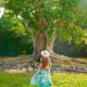 woman standing in front of a tree in southwest florida
