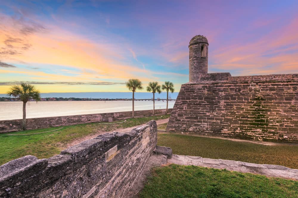 Sunset over the Castillo De San Marco and water.