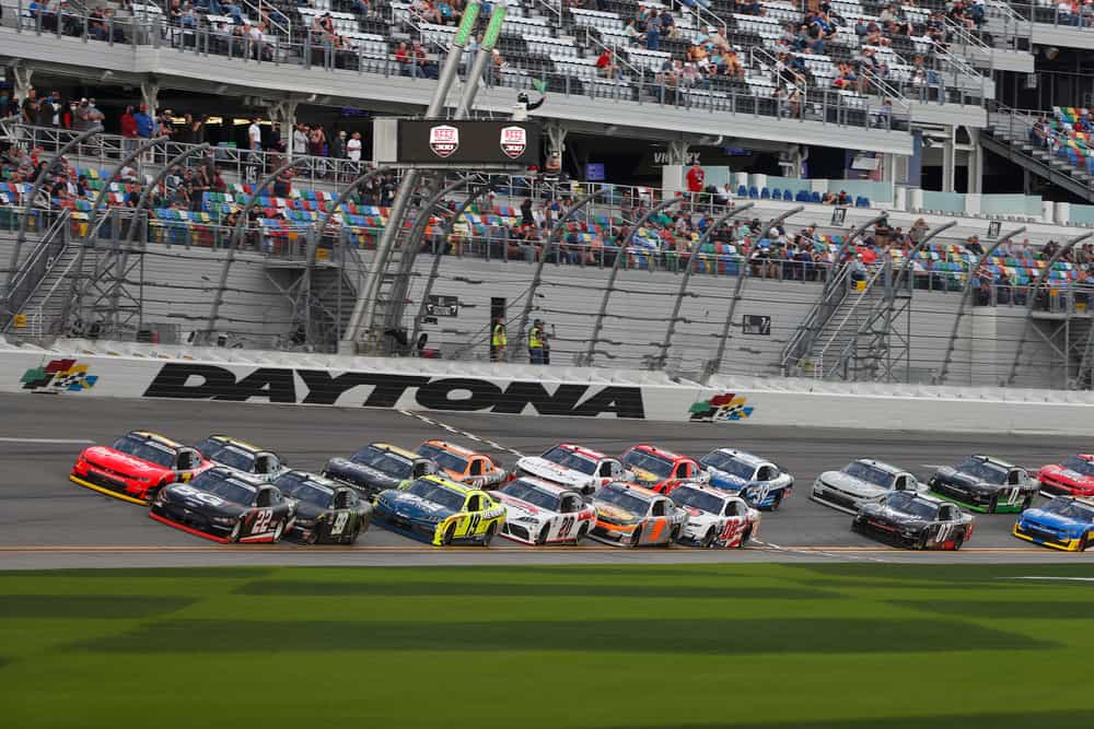 Cars race on the track at the Daytona International Speedway in Florida.