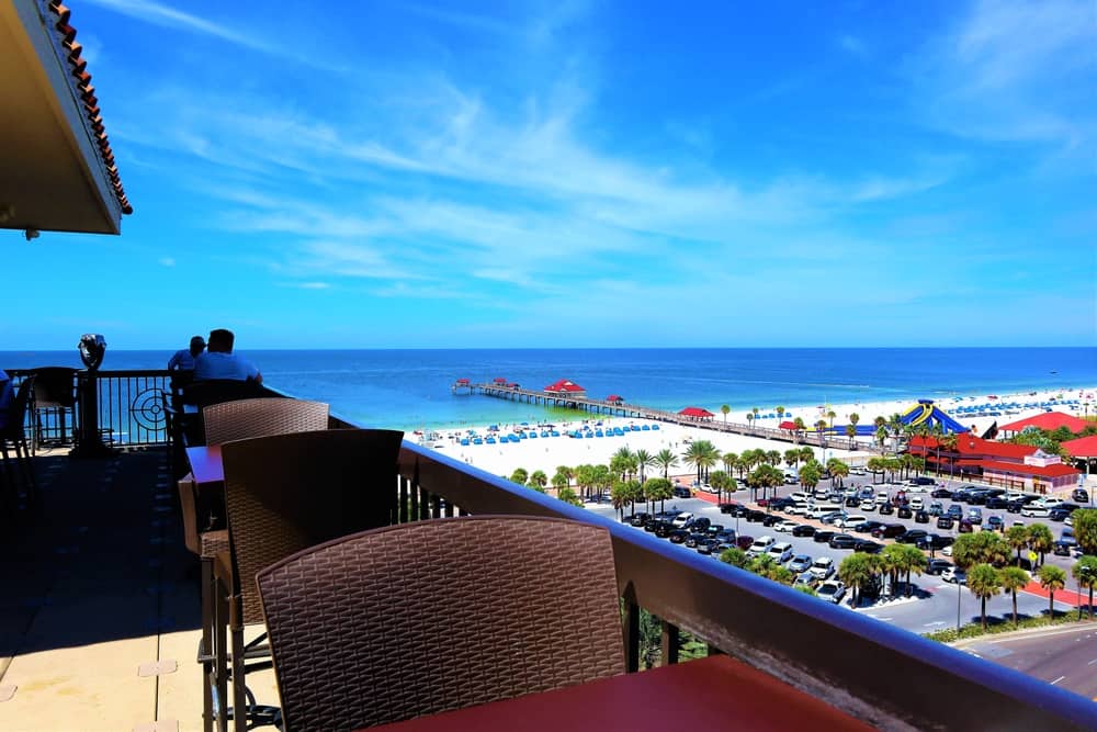 The outdoor dining deck of Jimmy's Crow Nest which looks out onto the Gulf of Mexico, where enjoying a drink at sunset is one of the best things to do in Clearwater Beach.