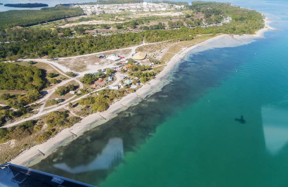 an arial view of Biscayne Bay national park with the water and shoreline as well as tree areas