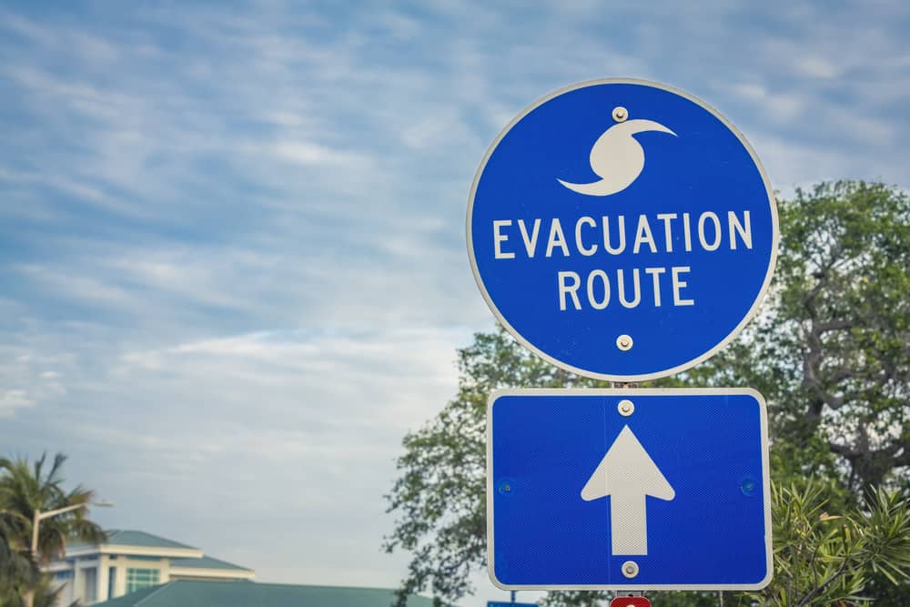 A sign that guides people to an evacuation route stands tall: knowing your evacuation route should be a part of your hurricane preparedness list.