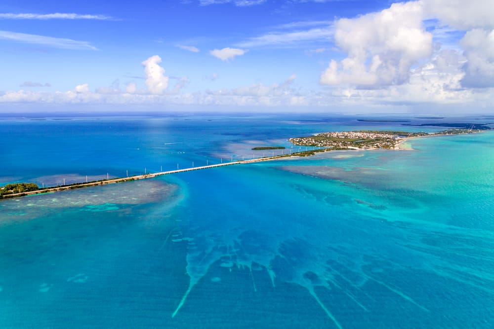 An overhead view of the blue waters, islands, reefs, and bridges show off why there are so many places for best snorkeling in the Florida Keys.