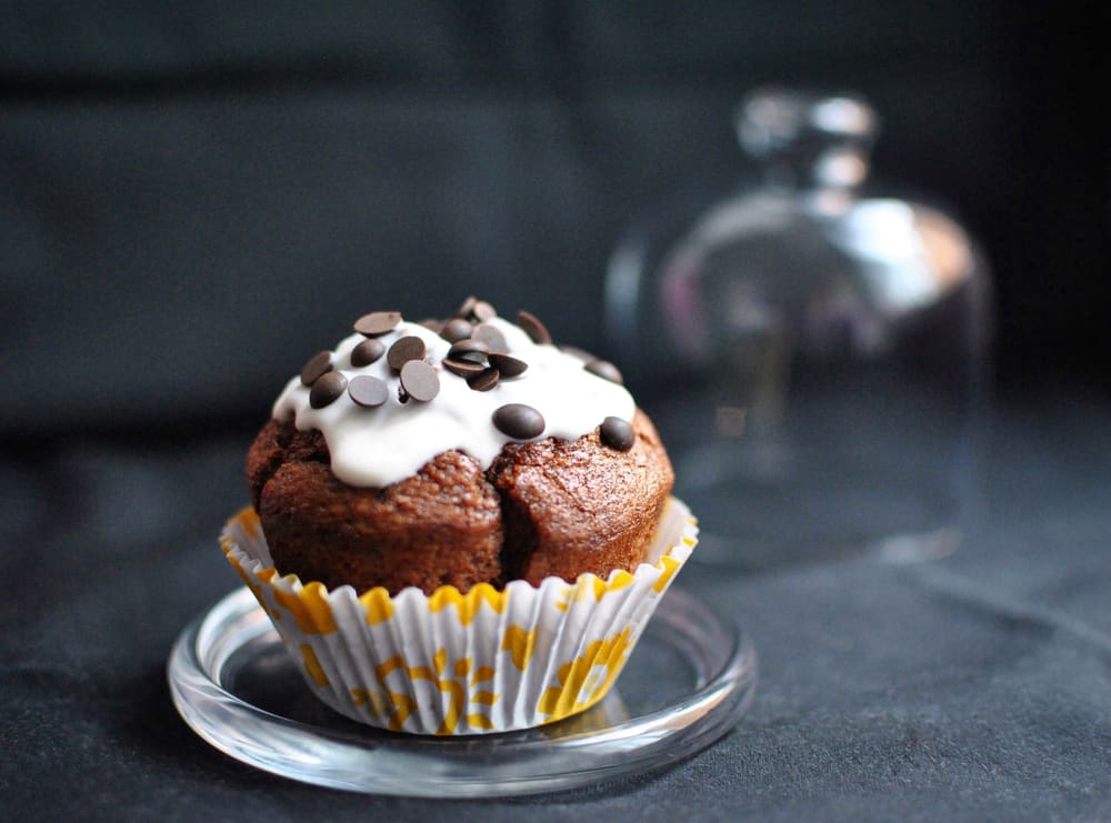 Gluten free and vegan options aren't hard to find for breaktast in Saint Augustine, FL! Things like this chocolate muffin are great options for those with dietary retractions: this chocolate muffin sits in a yellow wrapper on a glass plate. 