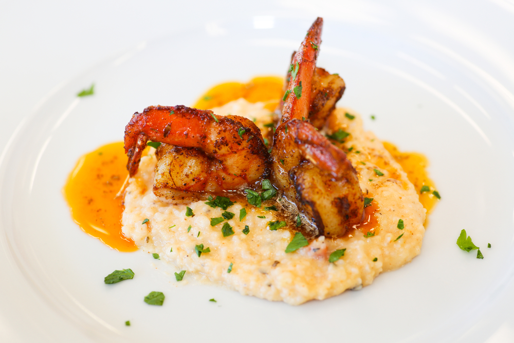 Three seasoned shrimp sit atop grits, like those served at Guppy's On the Beach, one of the most popular Indian Rocks Beach restaurants.