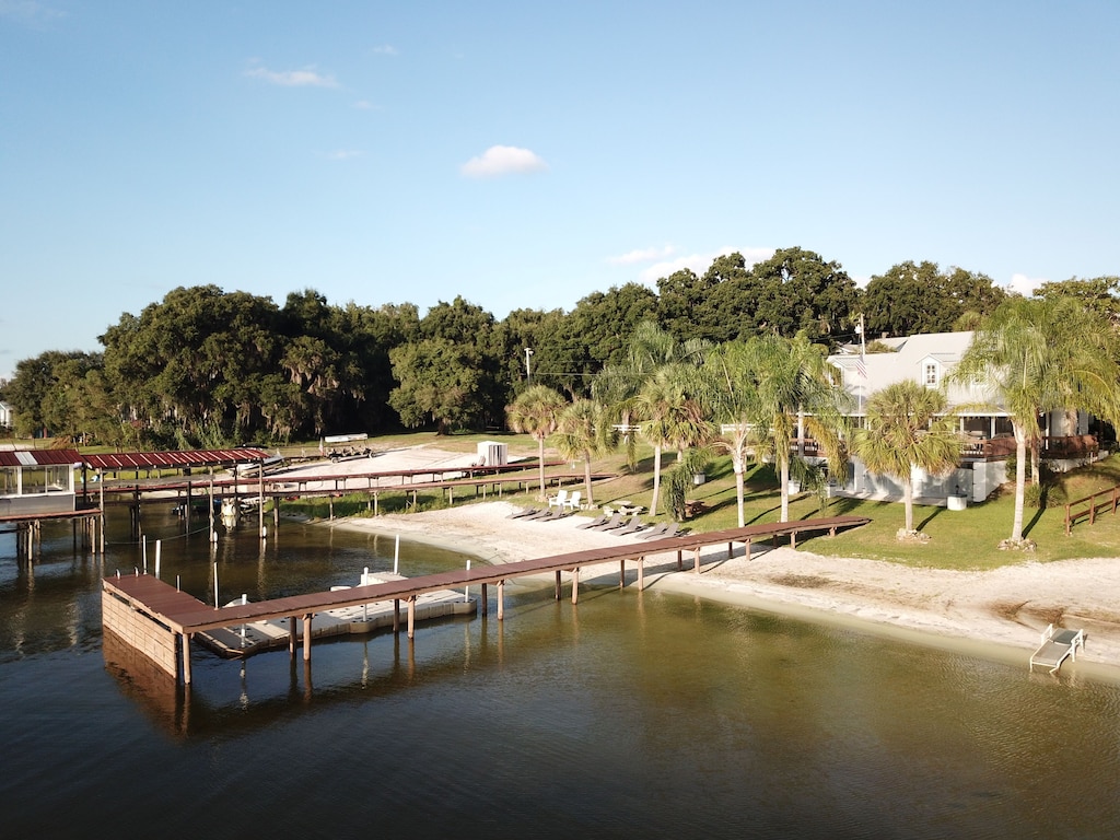 the sandy beach and two private docks of the Lakefront home